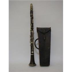 A LEATHER CASED BOOSEY CLARINET,15 hardwood with nickel fittings, length 65cm  £20-30...