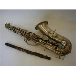 A CASED SAXOPHONE, 'The Elkhart, by Buescher, U.S.A', and a piccolo by Hawkes, London, (2)  £30-4...