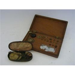 A MAHOGANY CASED SERIES OF CIRCULAR BRASS WEIGHTS, a Georgian small beamscale in japanned case an...