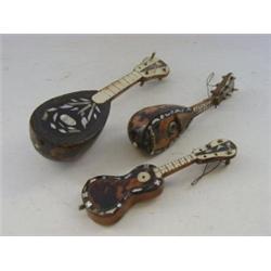 TWO MINIATURE MANDOLIN MODELS, and a guitar, all incorporating tortoiseshell, late 19th century /...