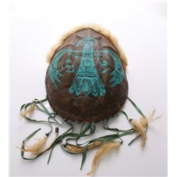 Native American painted turtle shell adorned with fur,