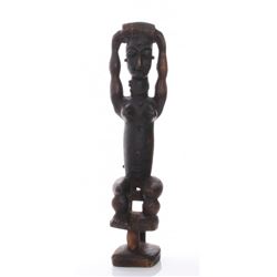 A mid century large African wood carving of a fertility