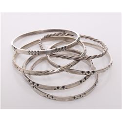 Five(5) Sterling silver bangles.  Four made by Frantz H