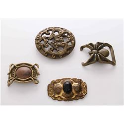 A collection of four (3) vintage belt buckles and an an