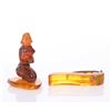 Image 1 : An amber figure carving and a Bakelite tie clip.  SIZE: