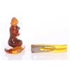 Image 2 : An amber figure carving and a Bakelite tie clip.  SIZE: