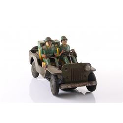Vintage Army jeep tin toy.  SIZE: see attached ruler ph