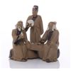 Image 1 : Early 20th Century mud men figurine of three men at a s