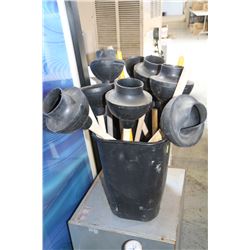 GARBAGE CAN FILLED WITH PLUNGERS