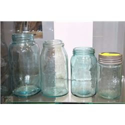 COLLECTION OF FOUR BLUE HUE GLASS CROWN JARS