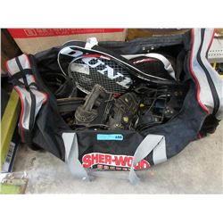 Hockey bag containing assorted sports gear