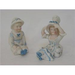 A PAIR OF TINTED BISQUE FIGURES, early 20th Century, sailor boy and girl, height 12cm  (2)  £30-4...
