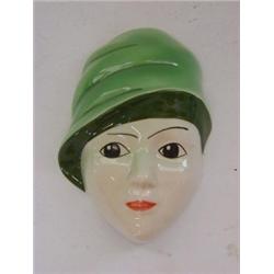 A CROWN DEVON WALL MASK, 1930's lady with green hat, decorated by Dorothy Ann, height 18cm  £30-5...