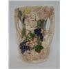 Image 1 : A CROWN DEVON TWIN HANDLED VASE, relief scene of cherubs collecting grapes, cream and coloured gl...