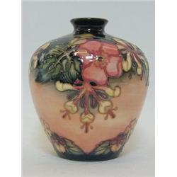 A MOORCROFT BALUSTER VASE, tube-lined honeysuckle design, 'WM' monogram, dated (19) 93, height 18...