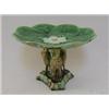 Image 1 : A MAJOLICA DESSERT COMPORT, c.1880, modelled as a lily pad, supported by three stork figures, tre...