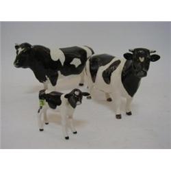 A SERIES OF THREE BESWICK FRIESIAN ANIMALS, Calf No.1249C. (smashed), Cow, No.1362A (leg s.d.) an...