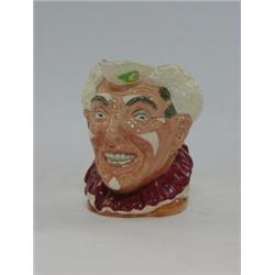 A ROYAL DOULTON CHARACTER JUG, white haired 'Clown', D6322, height 25cm  £400-500...