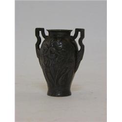 AN ART NOUVEAU PEWTER TWIN HANDLED VASE, early 20th Century, whiplash tendril design, crocodile m...