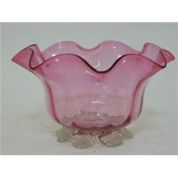 A RUBY GLASS BOWL, wavy rim, clear pincered foot, height 8cm  £30-40...