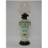 Image 1 : A PASTEL GREEN OPAQUE GLASS OIL LAMP, late 19th Century, over-enamelled foliage and insects, chim...