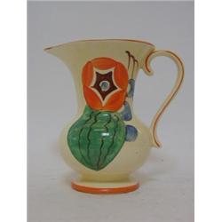 A FIELDINGS DEVON WARE JUG, 1930's, stylized floral design in orange, green and blue, marked 'ERO...