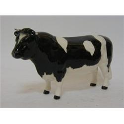 A BESWICK FRIESIAN BULL, CH. Coddington Hilt Bar, gloss, height 10cm  £50-70...