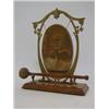 Image 1 : AN EDWARDIAN BRASS DINNER GONG, stylized frame, oak plinth, with hammer, height 30cm  £30-40...