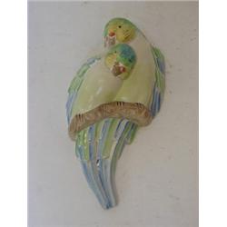 A CLARICE CLIFF WALL POCKET, two moulded parrots on a branch, height 22cm  £100-120...