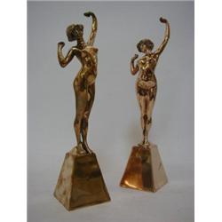 A PAIR OF ART DECO BRONZE FIGURES, nude females with arms outstretched on pyramid plinths, height...