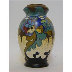 A GOUDA ART POTTERY BALUSTER VASE, abstract foliage design in blue, olive and iron red, signed 'C...