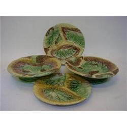A MAJOLICA PART DESSERT SET, 19th Century, pair of comports, and pair of plates, moulded vine lea...