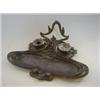 Image 1 : AN ART NOUVEAU METAL DESK STAND, of stylized naturalistic form, no ink wells, length 30cm  £30-40...