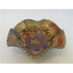 AN AMETHYST CARNIVAL GLASS BOWL, grape and cable design, diameter 18cm  £20-30...