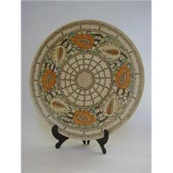 CHARLOTTE RHEAD FOR CROWN DUCAL, a circular wall plaque, tube-lined Rustic Trellis pattern, signe...