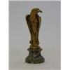 Image 1 : A CAST BRASS EAGLE PAPERWEIGHT, after A. Marionnes, on verte antique circular socle, height 12cm...