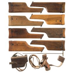 Eight Mauser Wooden Stock Holsters with Two Leather Holders and a Cleaning Rod