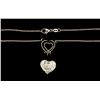 Image 2 : NECKLACE:  [1] Platinum oval rolo chain necklace with a center setting set with a heart shaped diamo