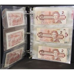 A)BINDER OF PAPER CURRENCY $1 AND $2