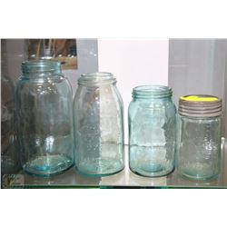 COLLECTION OF FOUR BLUE HUE GLASS CROWN JARS