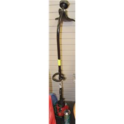 WEED WACKER AND CAN OF TRUE FUEL