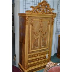 French style heavily carved matched grain, two door, three drawer cabinet with carved garland decora