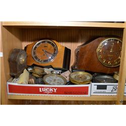 Shelf lot of assorted clocks including mantle, travel, etc plus barometers and parts
