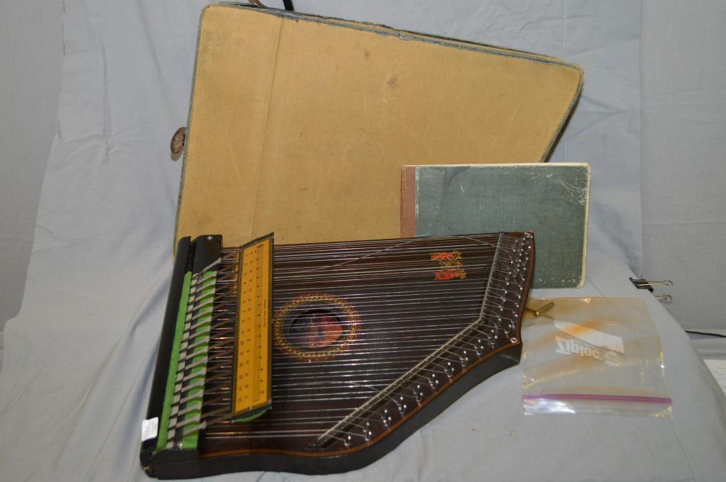 Vintage lap harpsichord in original case