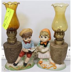 PAIR OF VINTAGE OIL LAMPS BOY AND GIRL
