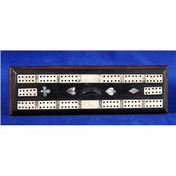 Haida Argillite Cribbage Board with Bone Inlays on a Wood Base ca. 1910  10 1/4" L. 3 1/4" W.  Good 