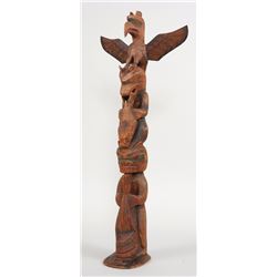 Early Charlie James Totem Carved with Thunderbird, Sea Bear Splitting a Seal and Bear Holding a Scul