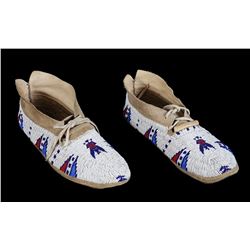 Pair of Beaded Moccasins with Eagle and Geometric Design and Parfleche Soles 11" L.  Good Condition