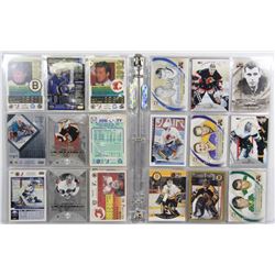 BINDER FILLED WITH ASSORTED NHL HOCKEY CARDS