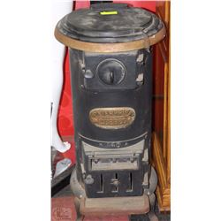 CAST IRON HEATER MISSING ONE LEG